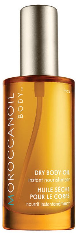 A bottle of Moroccanoil Dry Body Oil with a silver cap and a pump dispenser.